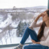 Seasonal affective disorder SAD depression winter season anxious alone young girl feeling lonely - stress, anxiety, melancholy emotion at home. Mental health problem.