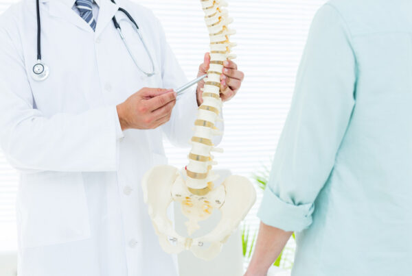 Doctor pointing anatomical spine