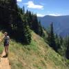 Summer Hikes in Oregon. Girl hiking in mountains or forest with summer cloths. Hobbies that are outdoors. Women enjoying a hike on her own. Hike with many trees and great view. Summer day adventures.
