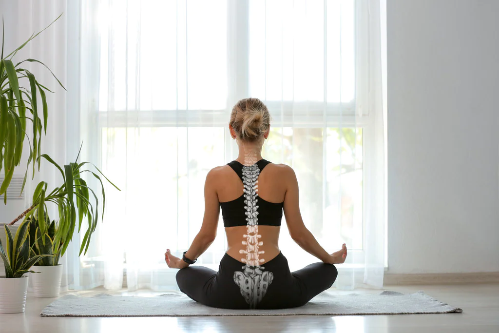Young woman with good posture meditating at home, back view