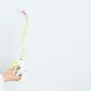 Doctor with human spine anatomy model representing spinal alignment and holistic wellness