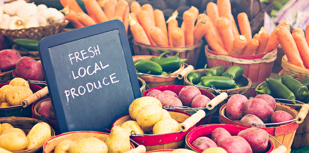 Display case with fresh local vegetables